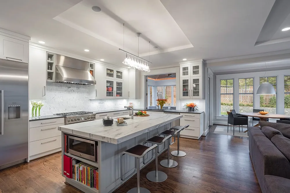 Examples of open concept kitchens with white cabinetry