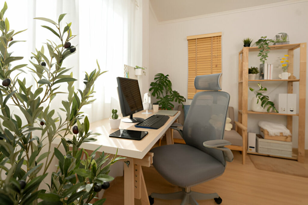 Bright home office with a modern desk, ergonomic chair, plants, and wooden shelving