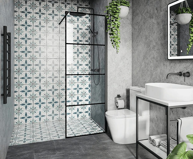 Modern small bathroom with patterned tile shower wall, black-framed glass shower, and concrete walls