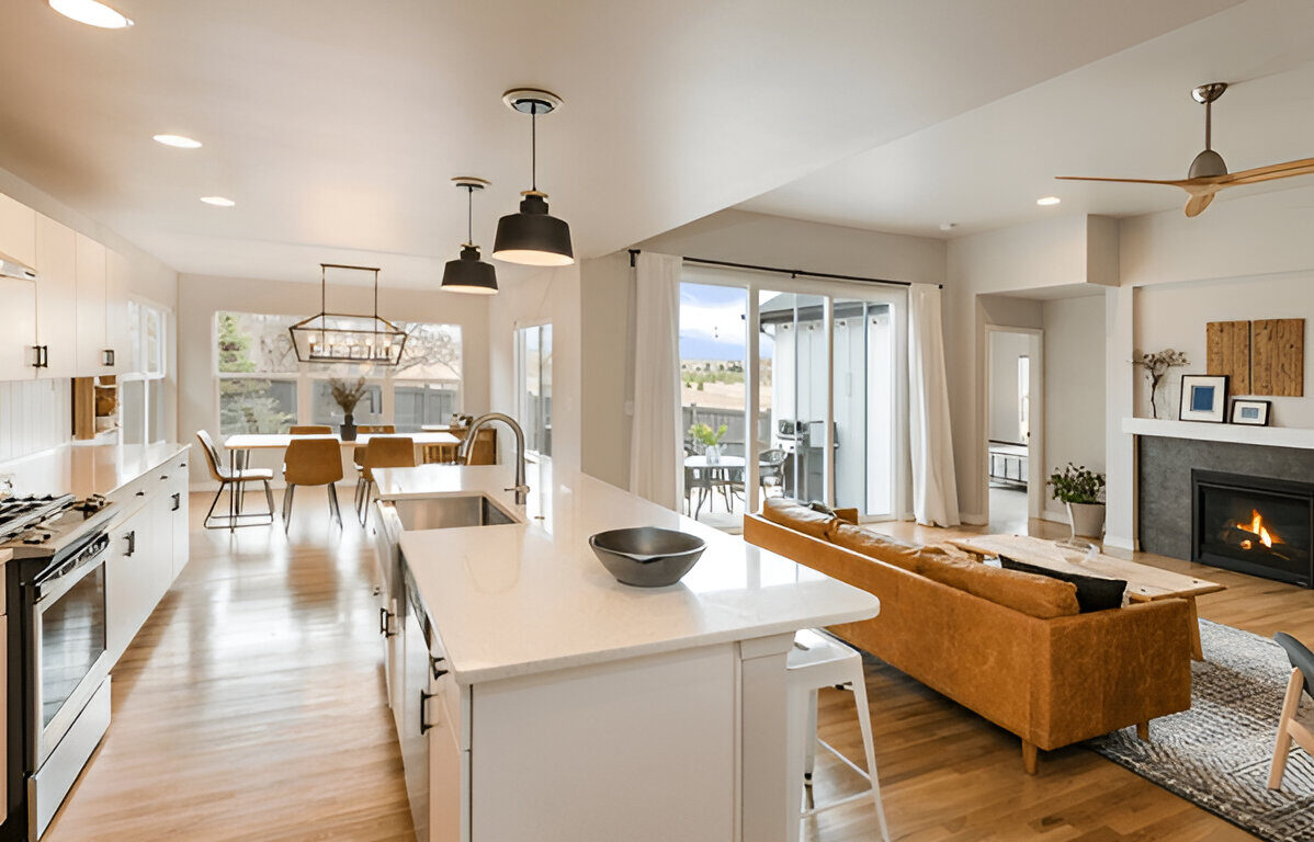 Creating an Open Concept Kitchen-Dining Space 11 Open concept kitchen and living area with island and fireplace