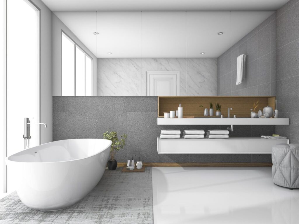Smart Remodeling Solutions for Small Bathrooms 10 Modern minimalist bathroom with a sleek freestanding tub, floating vanity, large mirror, and neutral gray-white tones