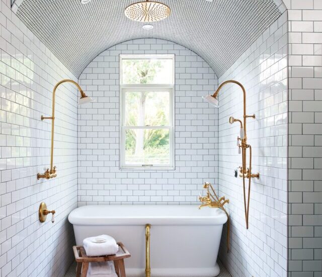 bhg-arched-doorless-shower-tile-subway-tile-tub-gold102877317-a276b45b513e4c42969a3b859f93534a