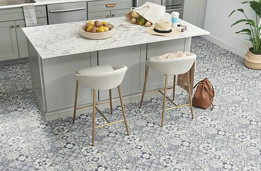 Creative Kitchen Floor Ideas 11 Modern kitchen with a gray island, white marble countertop, and stylish patterned vinyl sheet flooring in blue and white tones.