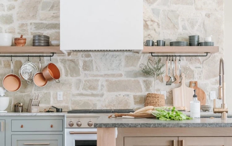Modern Kitchen Backsplash Ideas in Alide, VA 8 Rustic kitchen design featuring a natural stone backsplash, open wooden shelves, and copper cookware