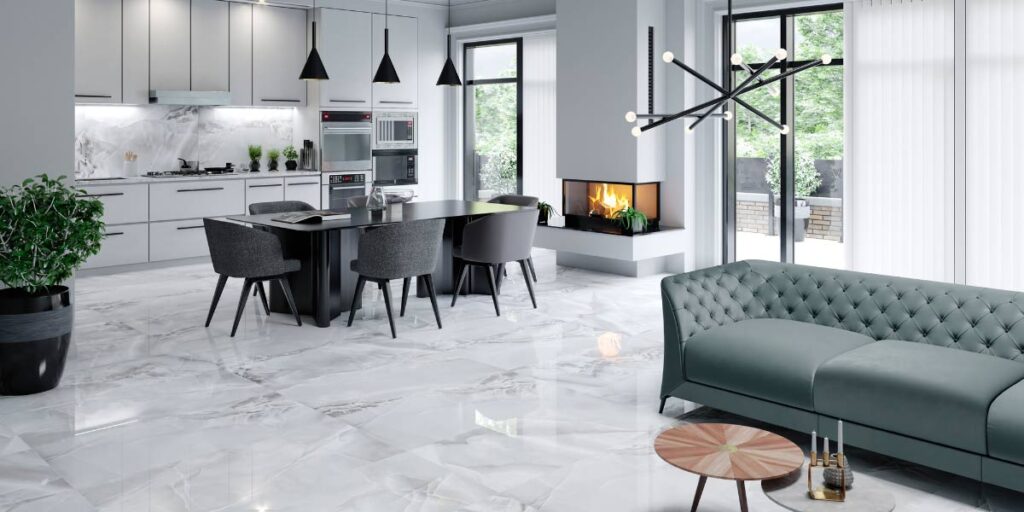 The Ultimate Guide to Kitchen and Floor Tiles 12 Contemporary open-concept kitchen and living area with large glossy marble floor tiles, minimalist cabinets, island seating, and a modern fireplace