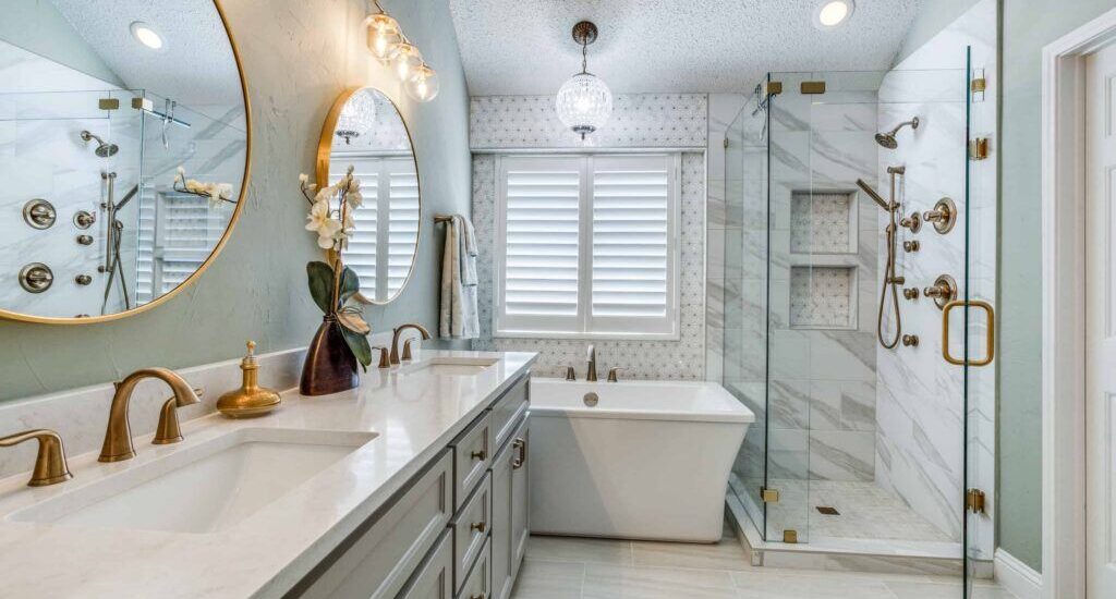 Elegant bathroom with round mirrors, freestanding tub, and marble shower