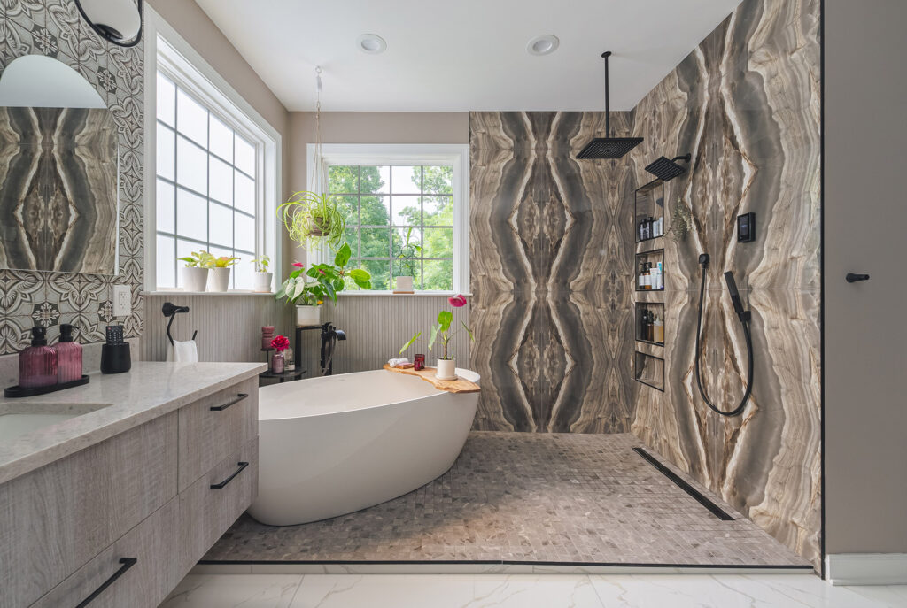 Nature-inspired bathroom with bold stone shower and freestanding tub