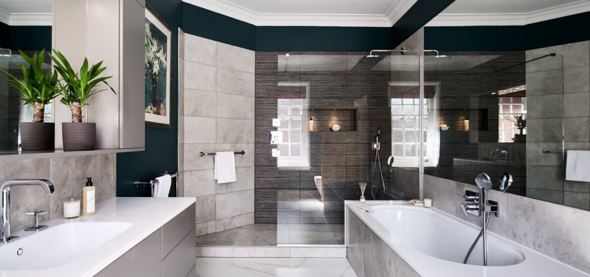Contemporary bathroom with white and gray tones, walk-in shower, and built-in bathtub.