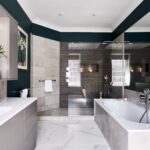 Contemporary bathroom with white and gray tones, walk-in shower, and built-in bathtub.