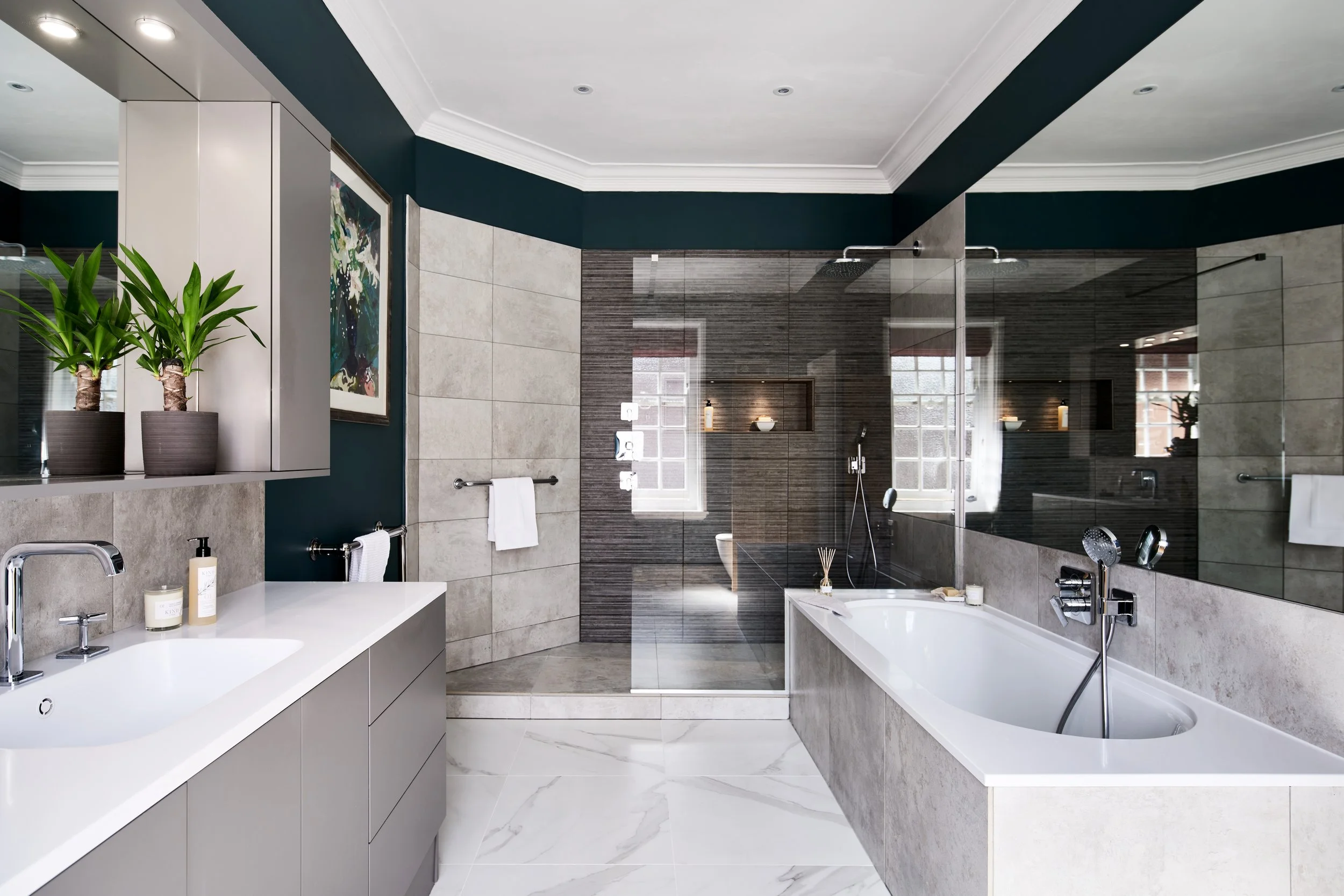 Modern bathroom with bathtub, walk-in shower, and vanity sink.