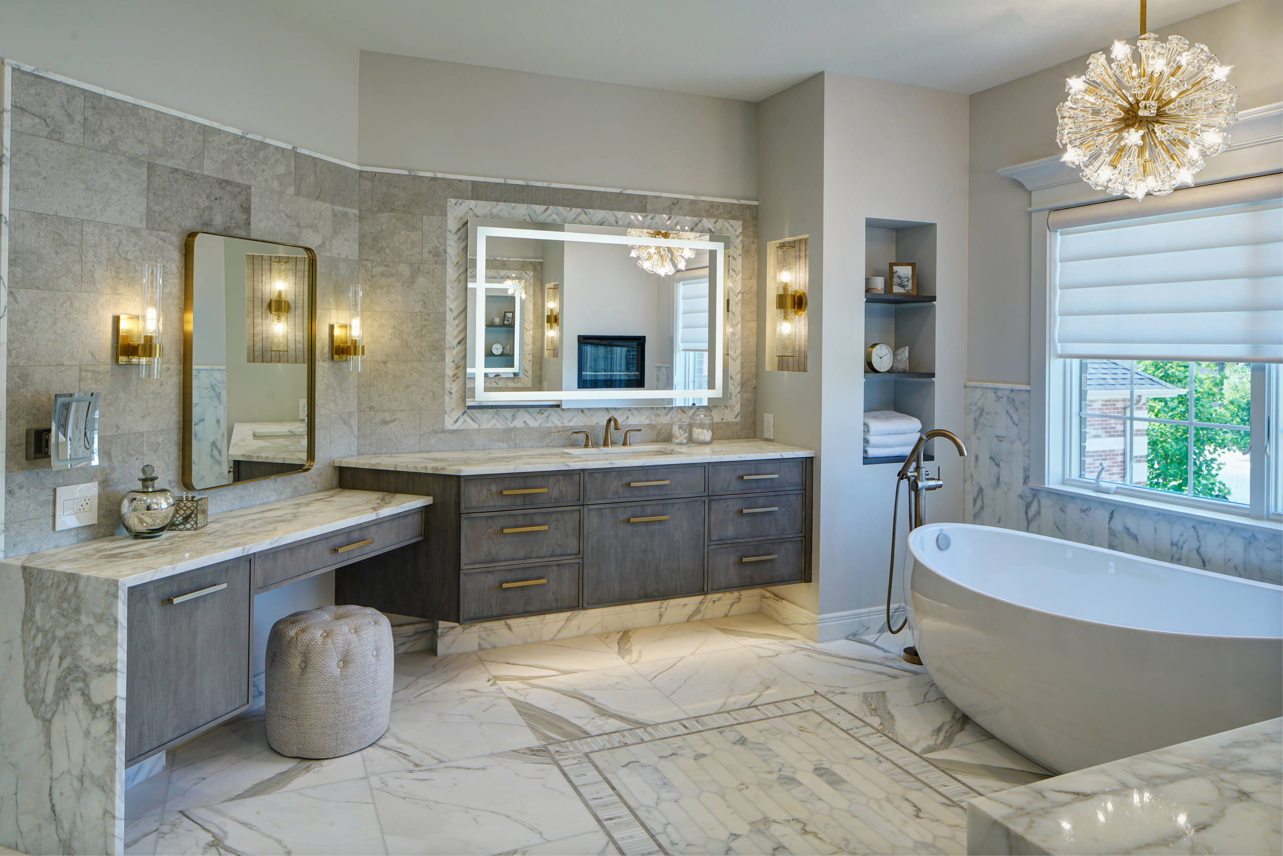 Luxurious master bathroom with marble flooring, freestanding tub, and modern double vanity.