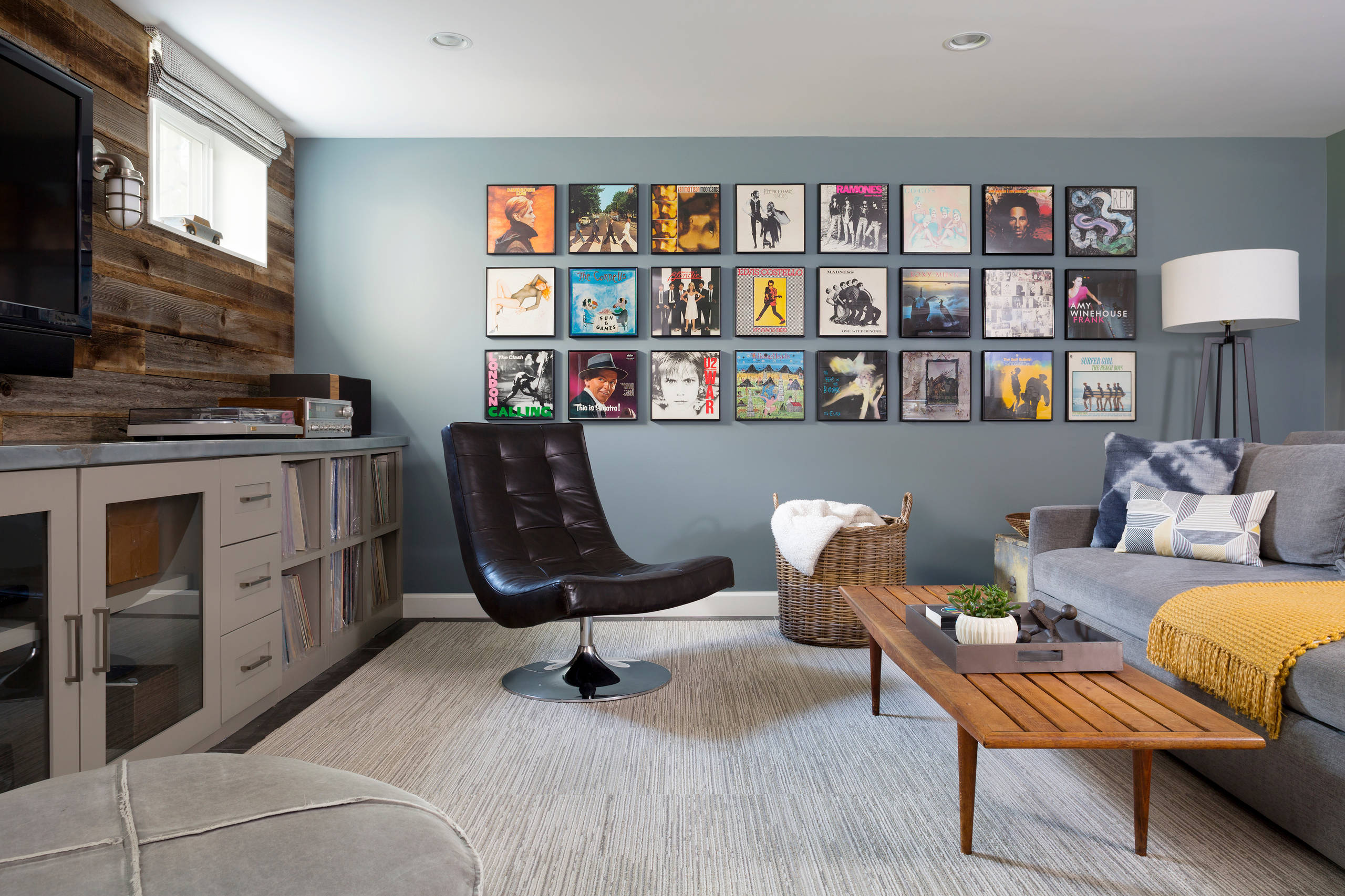 Modern man cave with record collection wall display