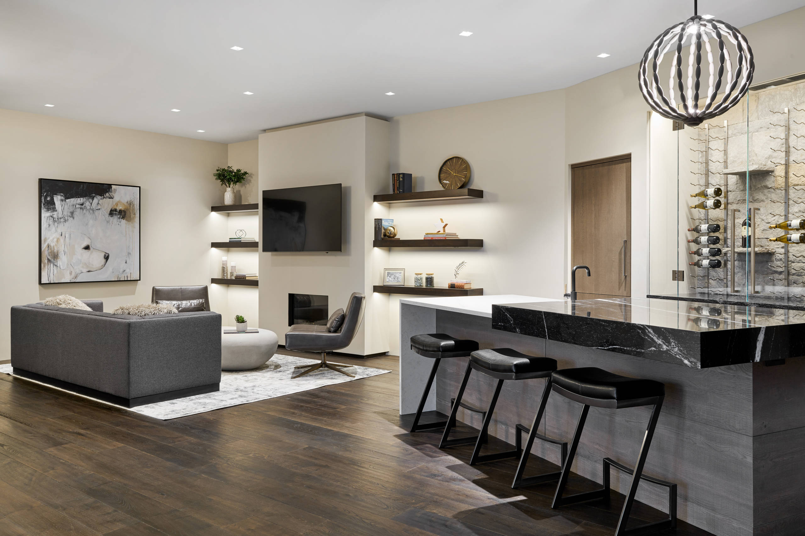 Modern open-concept living room with bar area and contemporary décor