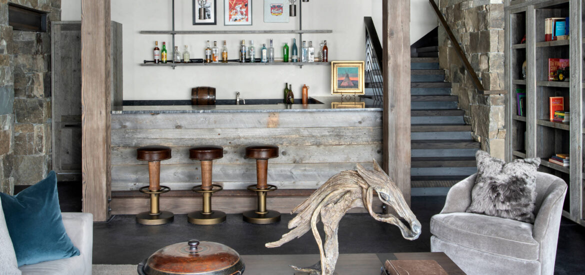 Rustic home bar with stone accents and wooden furniture
