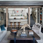 Rustic home bar with stone accents and wooden furniture