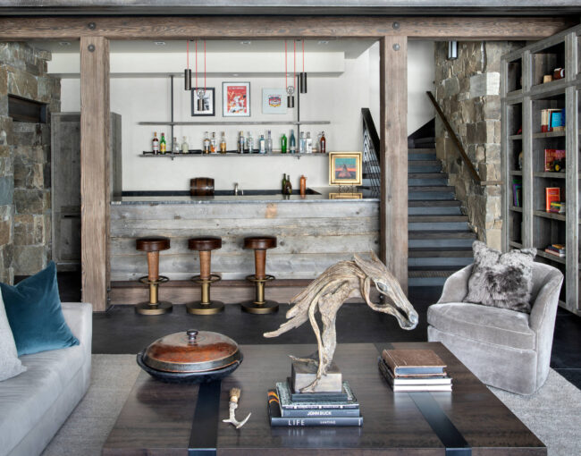 Rustic home bar with stone accents and wooden furniture