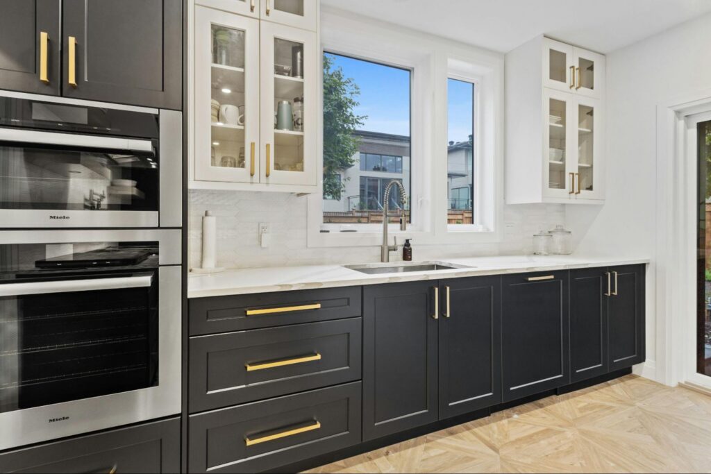 Chantilly kitchen with marble countertops, subway tile backsplash, and white cabinets